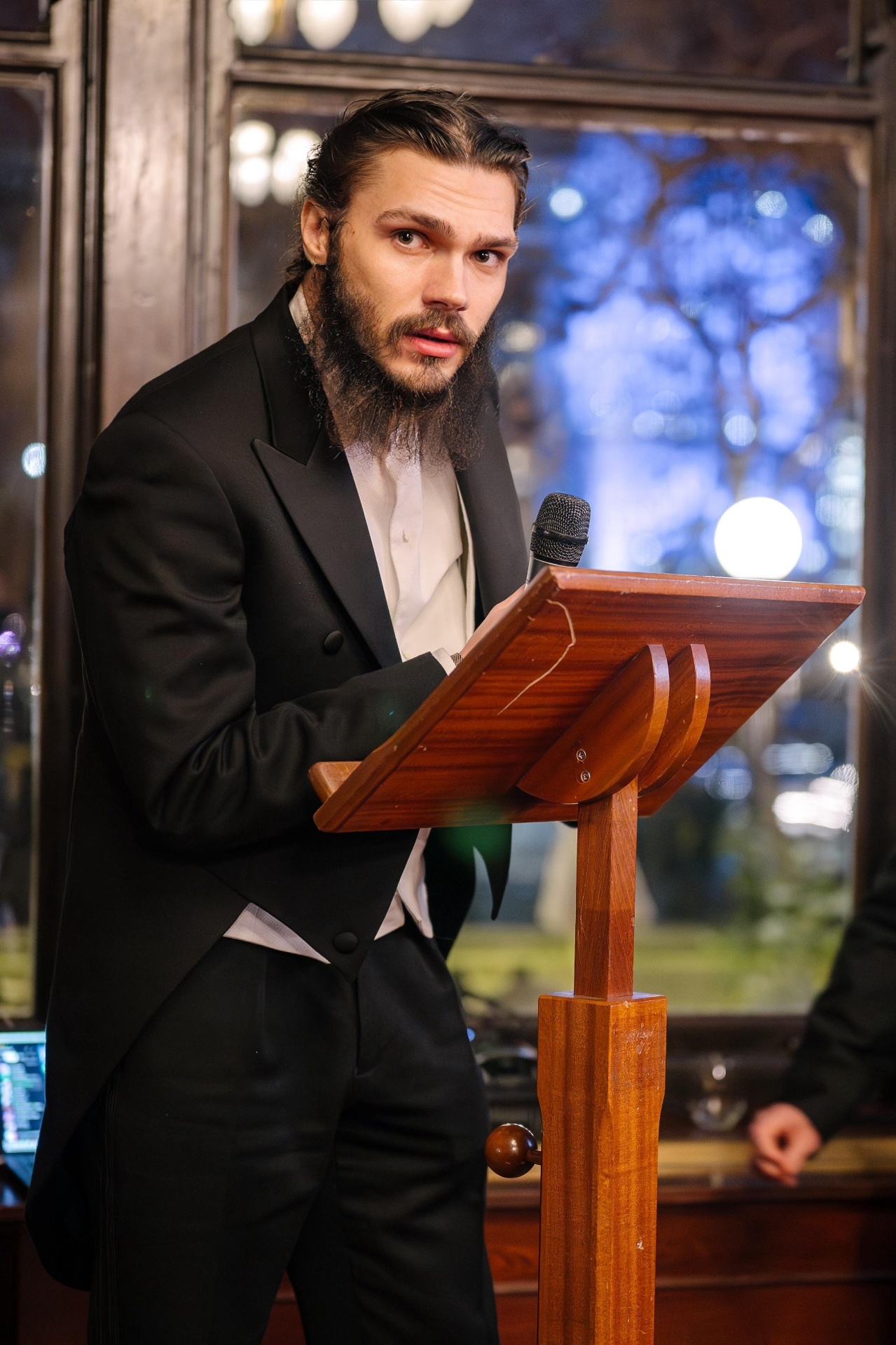 Mihai Alexandru Crăciun, 13th Baron of Brattleby, addressing the white-tie gathering at the podium during The Winter Banquet 2025 — Noble House of Brattleby, London